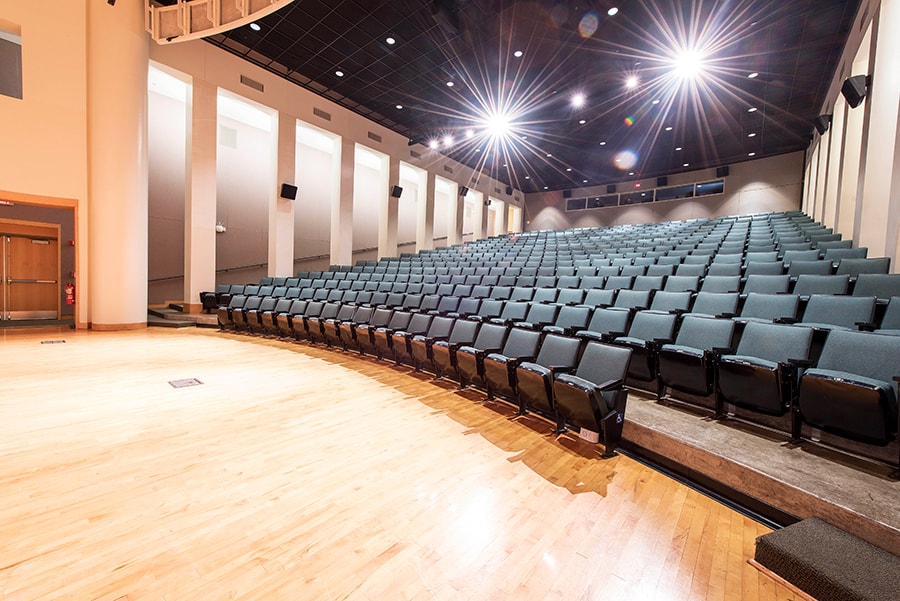 Photo of McConomy Auditorium looking from the corner of the stage at rows of seats